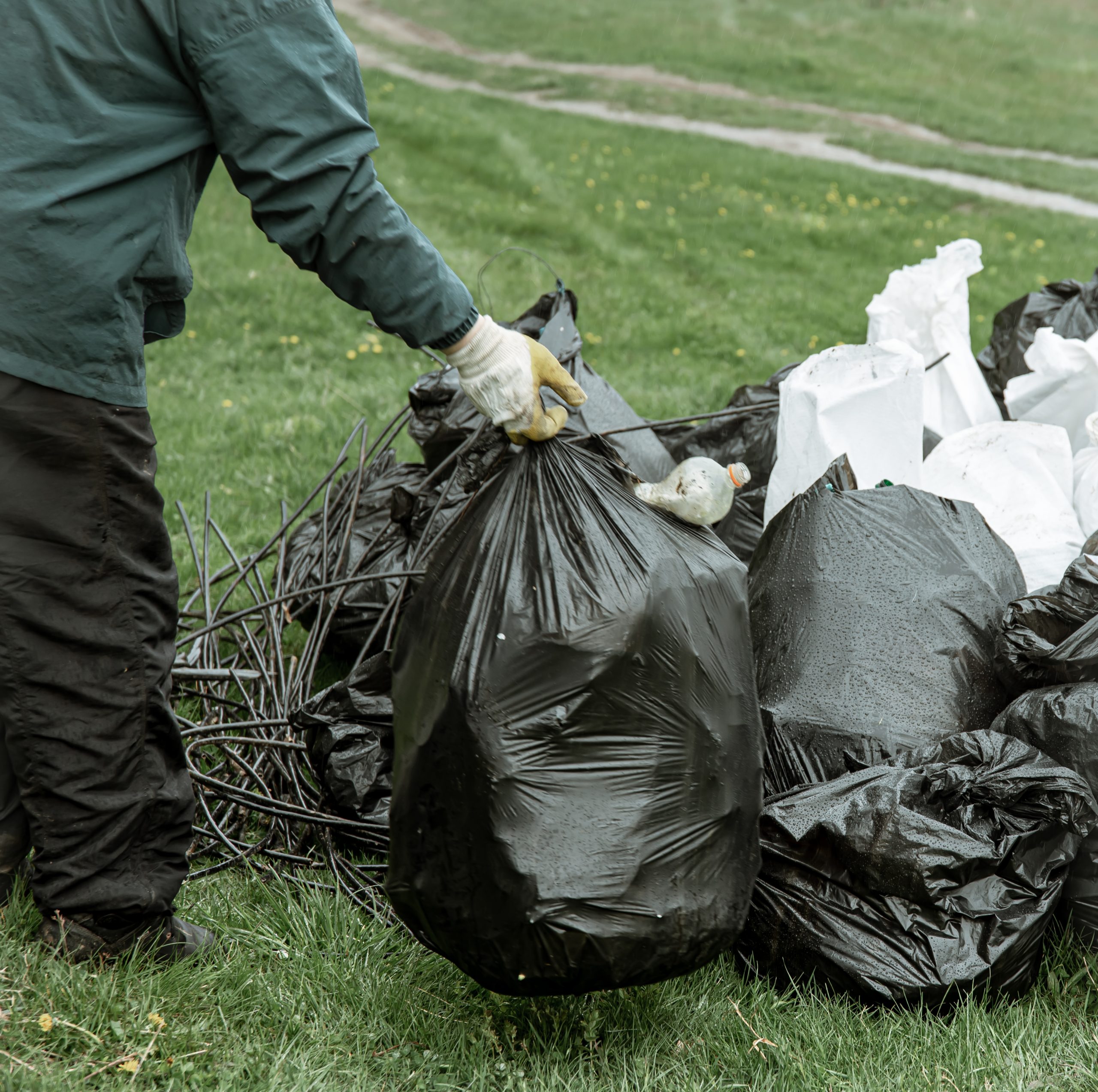 Close up of trash bags filled with trash after cleaning the environment.